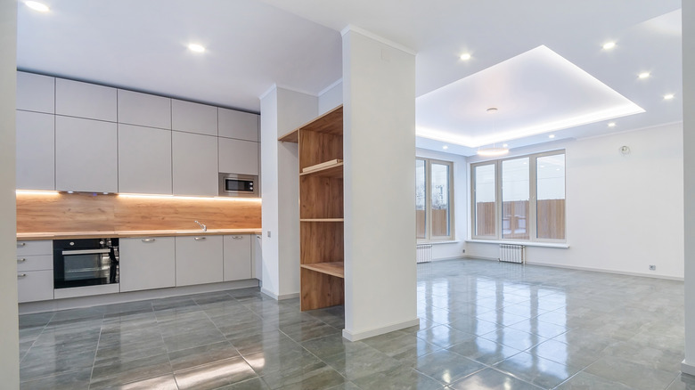 white kitchen with gray floor tiles