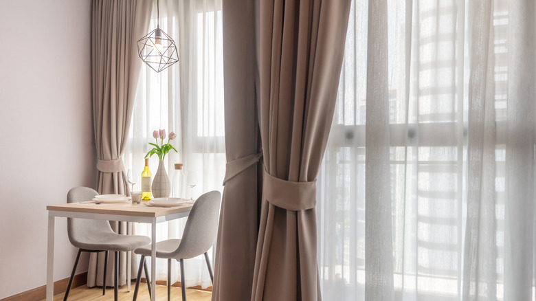 drapes next to a dining nook