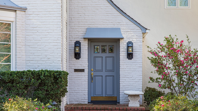 Blue door on white house