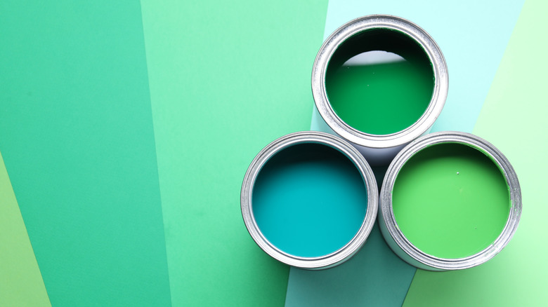 Cans of green paint.