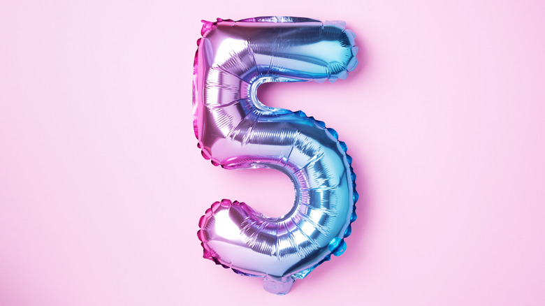 number five balloon on pink background
