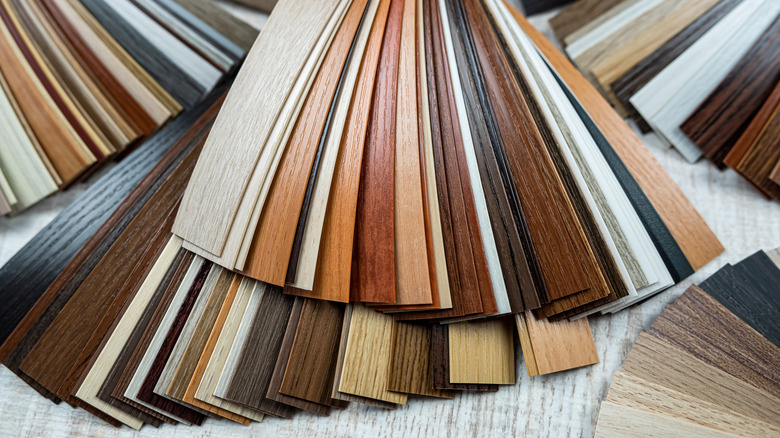 A collection of different colored vinyl sample strips layered on top of each other.