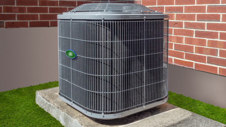 outdoor HVAC unit on grass