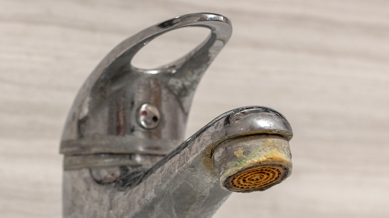 rusty chrome tap