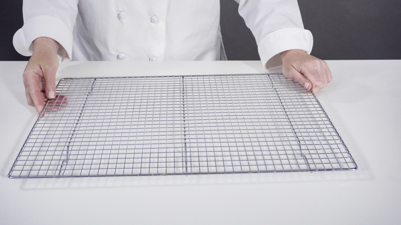 Someone holding a wire cooling rack