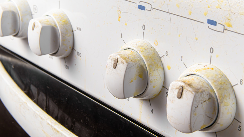 Yellow stains on a gas stove's white knobs