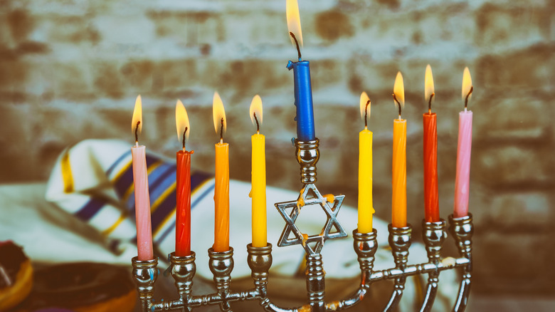 Lit menorah with colorful candles