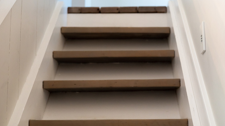 Wood stairs with trim painted white