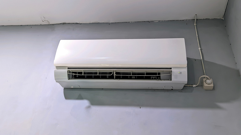 Ductless mini split air handler on a gray wall