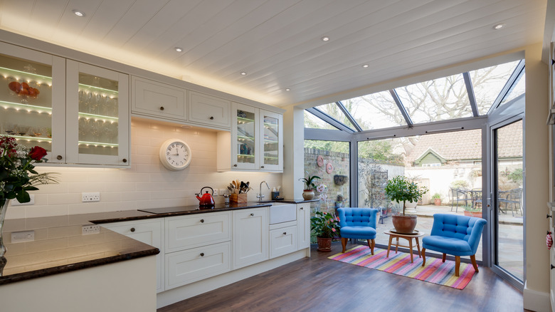 A home kitchen space with long boards across the ceiling