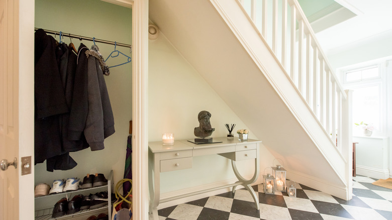 Home entrance with lit candles and diffuser reeds