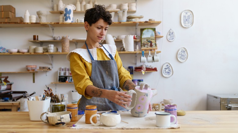 woman in pottery home studio