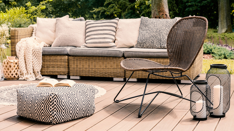 A sofa, chair, and pouf in an outdoor living space
