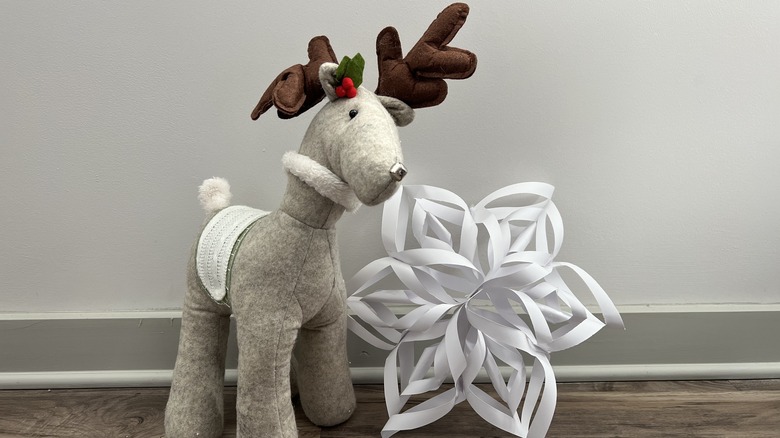 stuffed reindeer with paper snowflake
