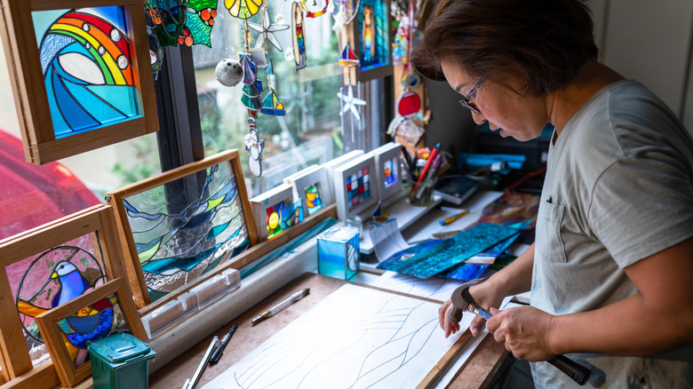 person making stained glass