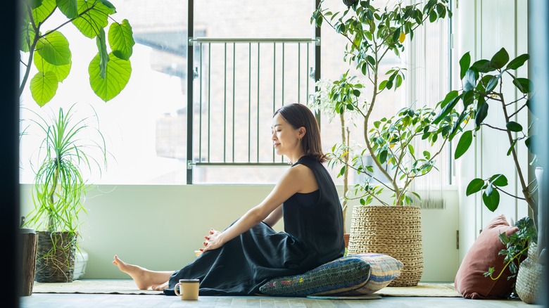 Woman surrounded by plants