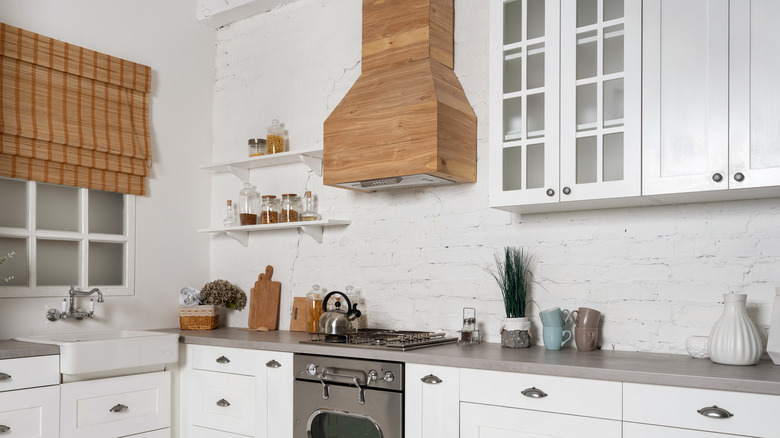 Kitchen with wood range hood 