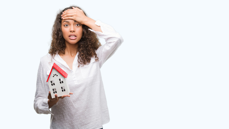 Woman holding house concept