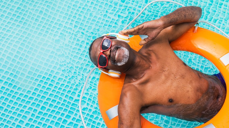 man swimming with music 