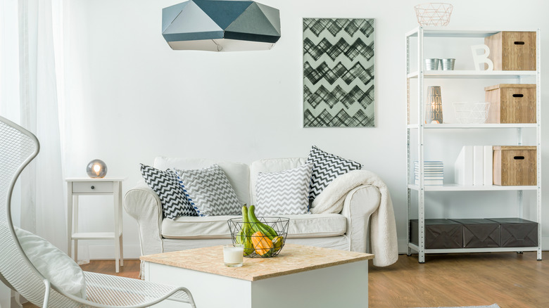 Neat, bright living room with bold, sculptural furniture