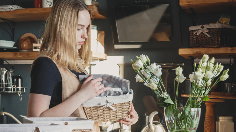 Taurus women in luxe kitchen evaluating a dishcloth collection