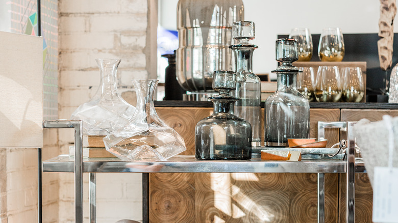 Glass decanters on bar cart