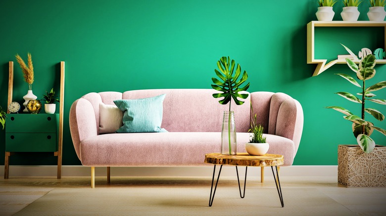 modern beige sofa with green wall