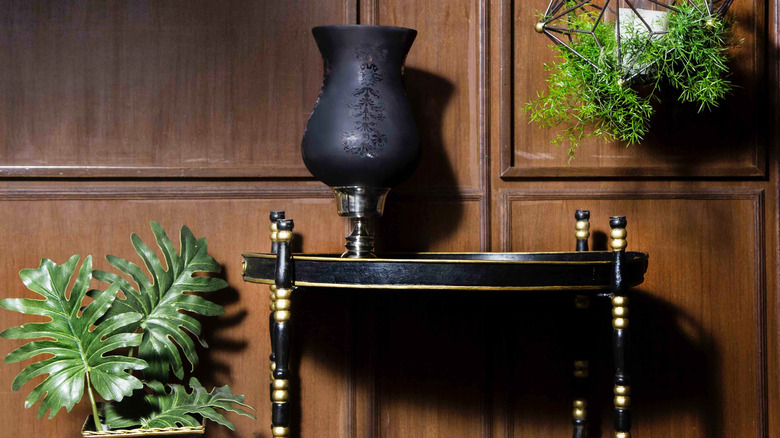 black console table with vase