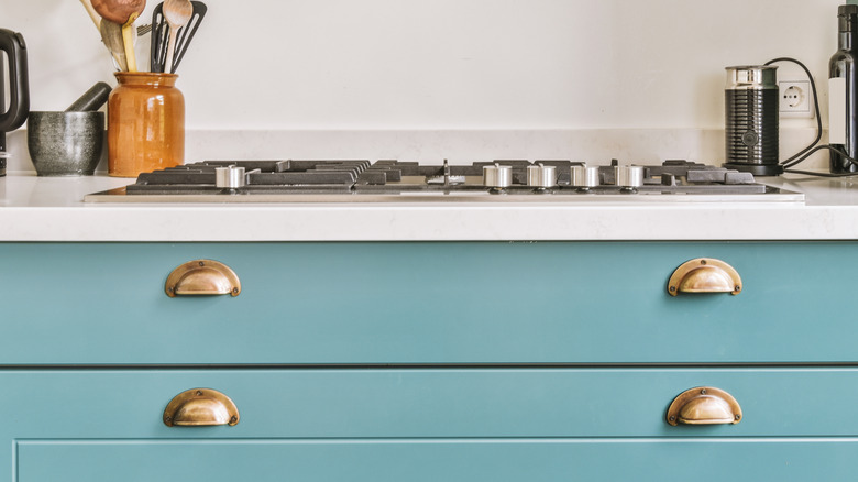 unique brass handles on kitchen cabinets