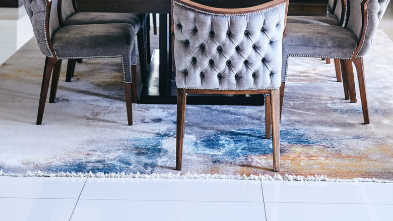 bold rug on gray floor