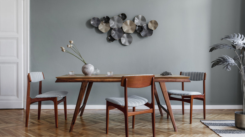 dining chairs and art around table