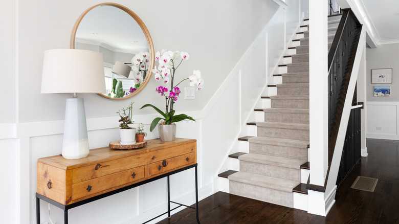 foyer with table and staircase