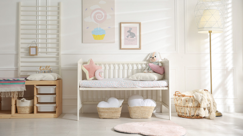 baby nursery with white crib