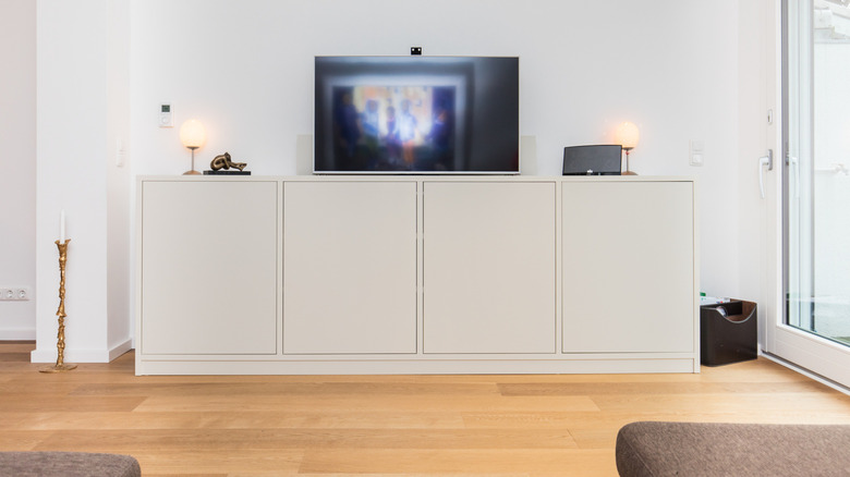 two lamps around the television