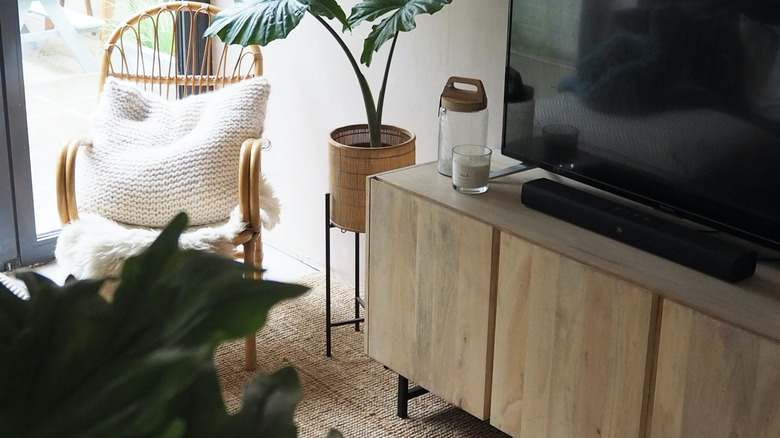 candles around tv stand