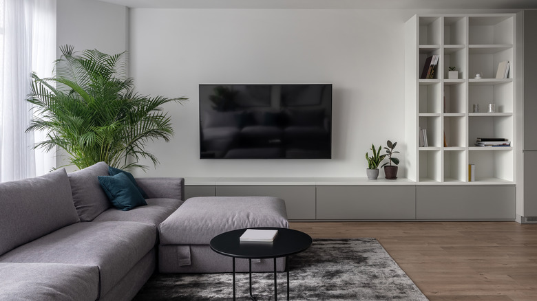 television next to purple couch