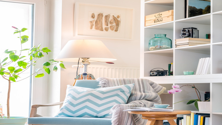 Bookshelf with items scattered throughout