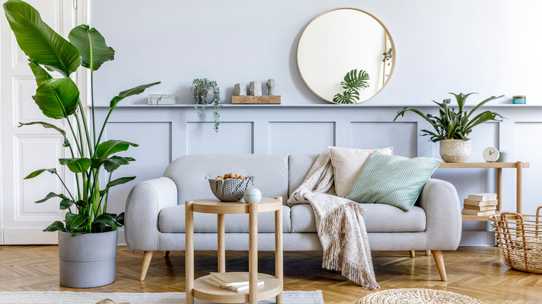 round mirror on wall ledge
