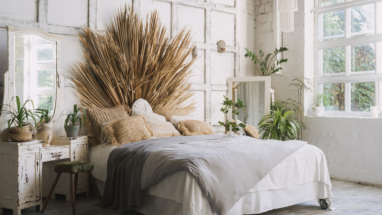 bed with dried grass and plants