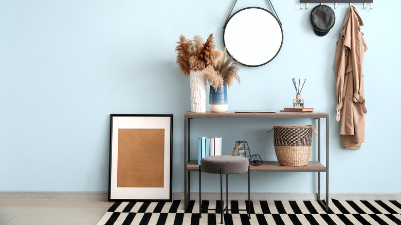 gray stool in front of console table