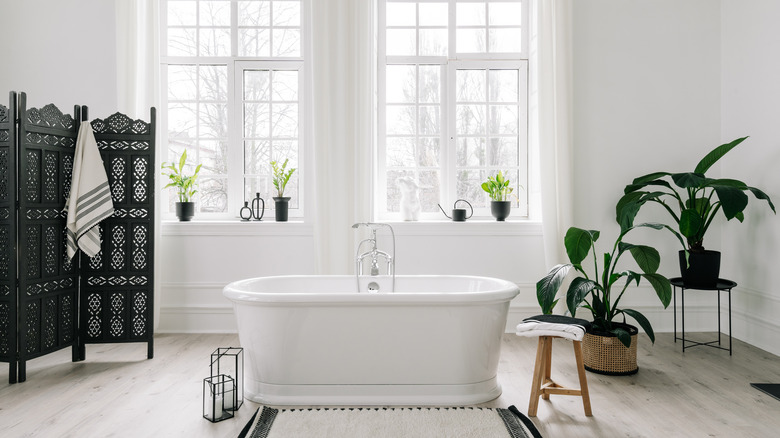 all-white bathroom with tub