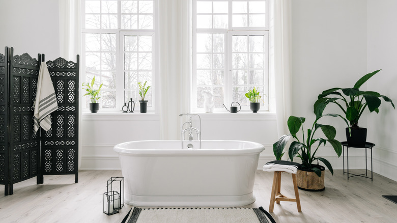 all-white bathroom with tub