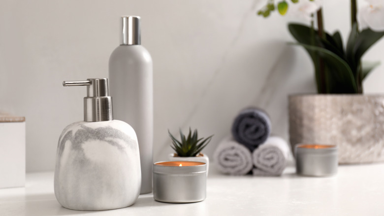 white soap dispensers in bathroom