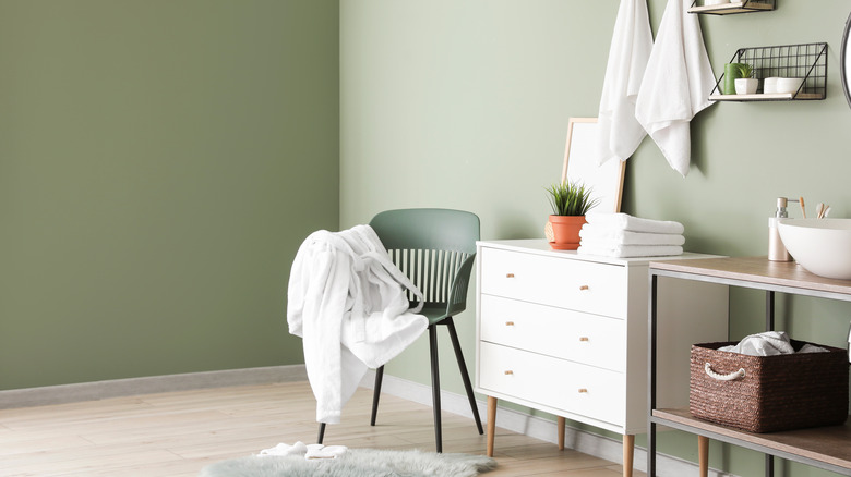 Green chair in bathroom