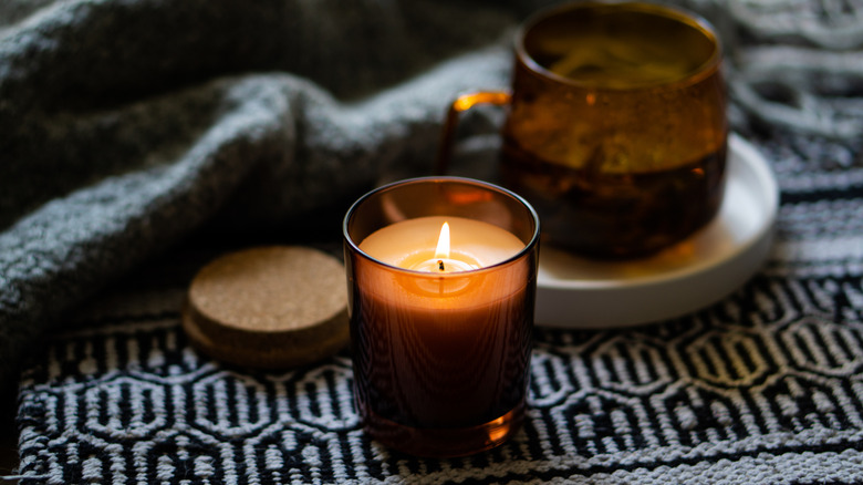 candles on a textured mat