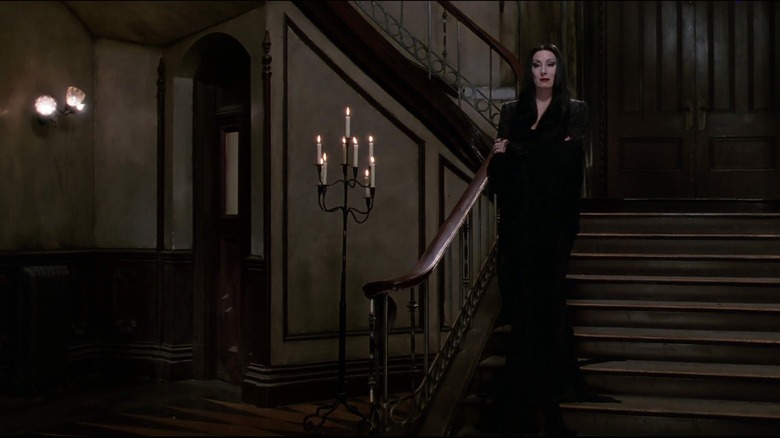 Morticia Addams on staircase