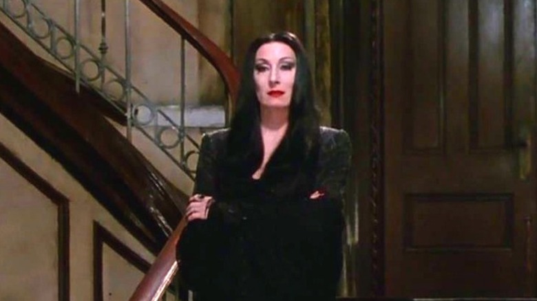 Morticia Addams on staircase