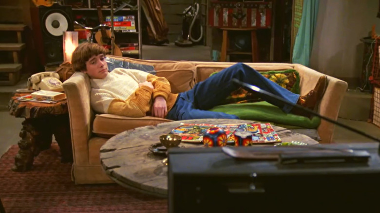 Eric Forman on brown couch