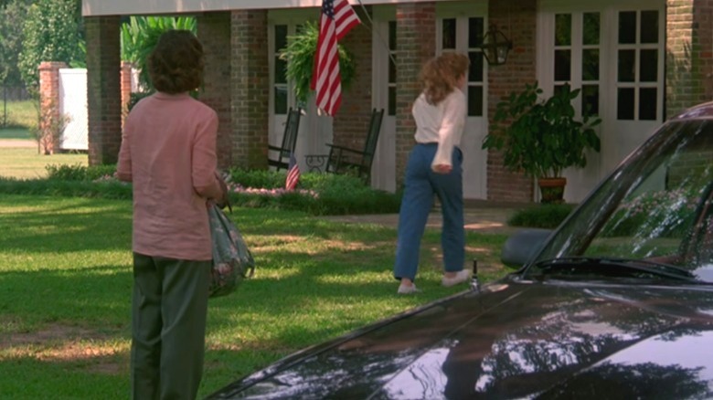 two women a car and rocking chairs