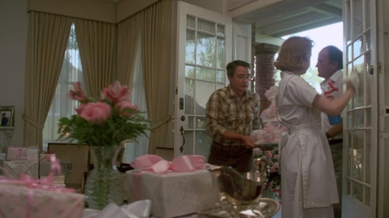 men bringing in wedding cake